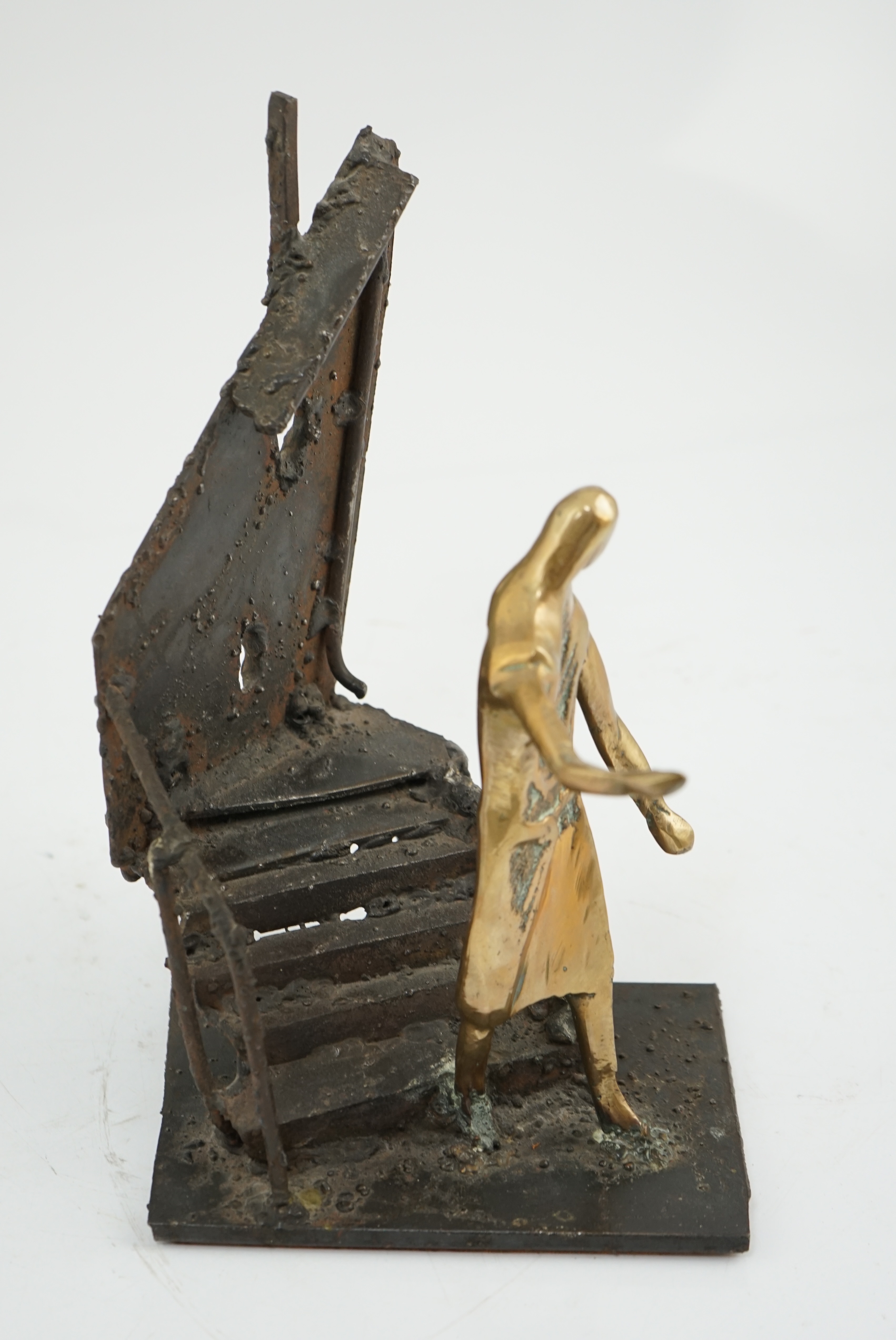 Arthur Dooley (British, 1929-1994), a bronze and iron group of a figure descending a staircase, 19cm wide, 29cm high